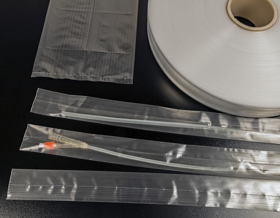 Embossed bags and reels for catheters